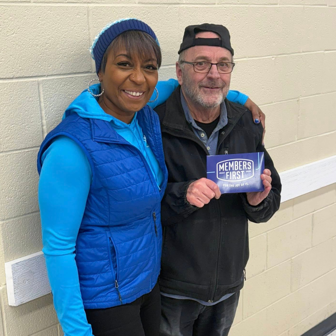 M1 Team Member Hands Out Giftcard